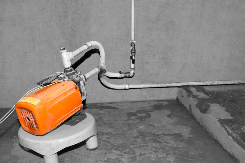 Human Right to Water in Delhi - An illegally fitted Tullu Pump to lift water directly from the supply line to an overhead tank in a planned colony in Delhi